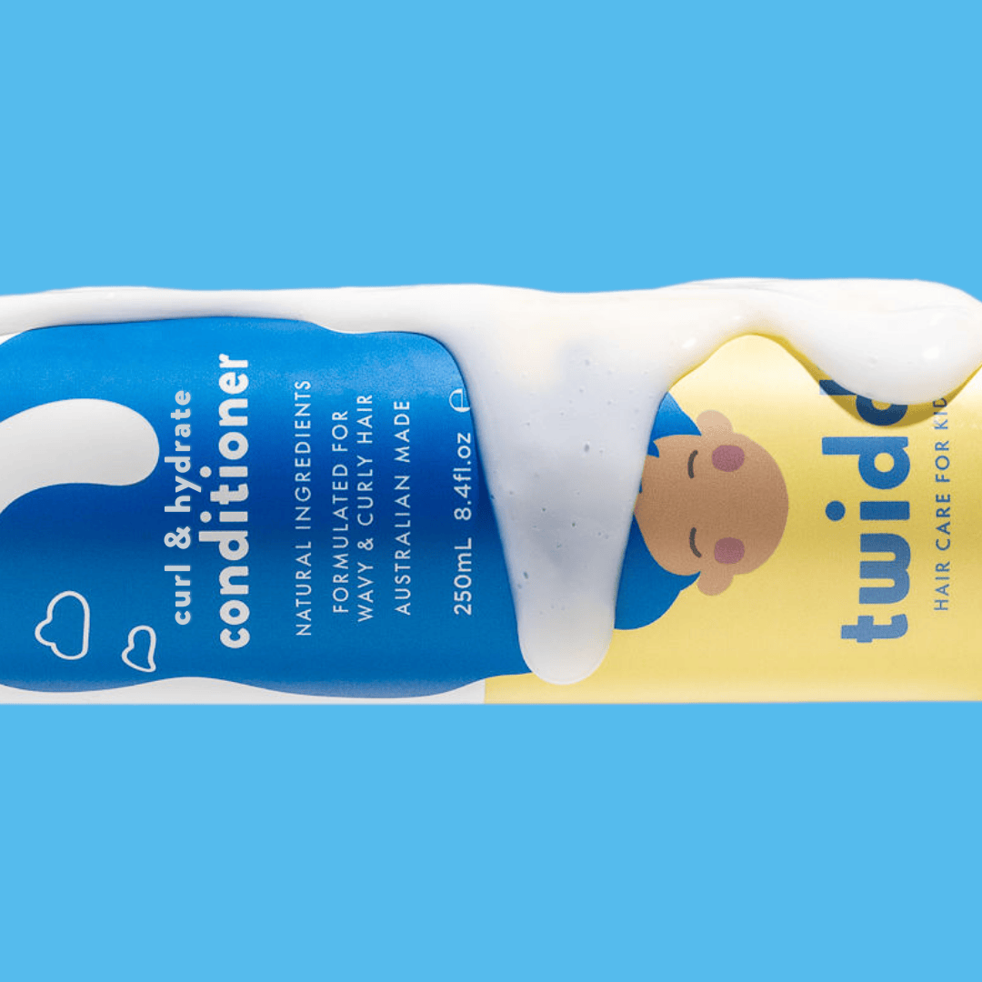 Twiddl curl & hydrate conditioner bottle with blue and yellow label and white cream on a blue background